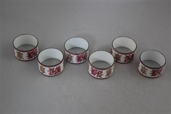 A set of six late 19th century enamel on copper circular napkin rings, 2in.